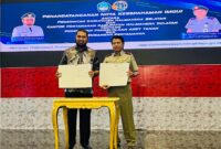 Bupati Halsel Bassam Kasuba dan Kepala Badan Pertanahan Nasional Halsel Drs. Winarno Nuswantoro, M.S jalani kerja Sama (dok//sadam)